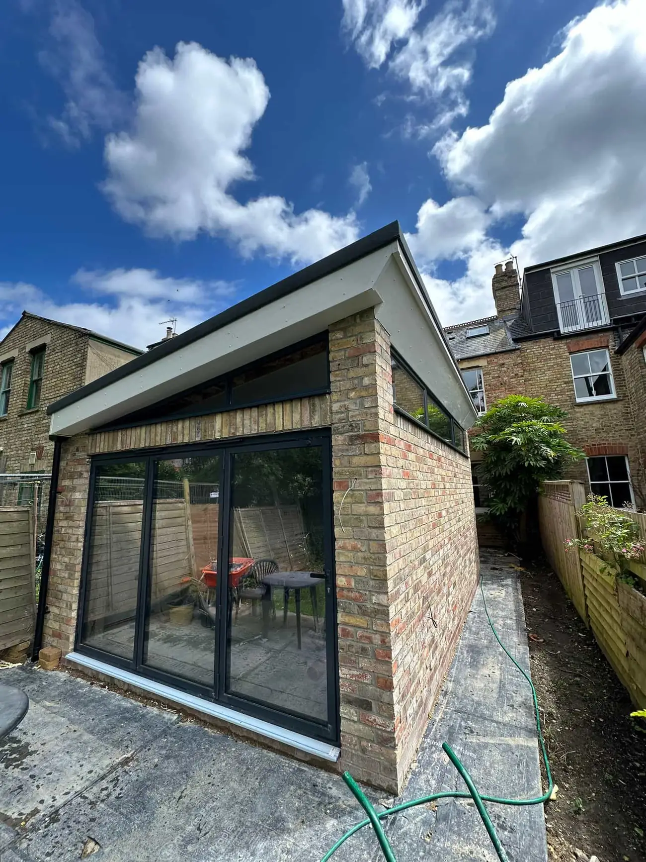 Modern single-storey rear extension in Oxford with dark-framed glazing and brick facing