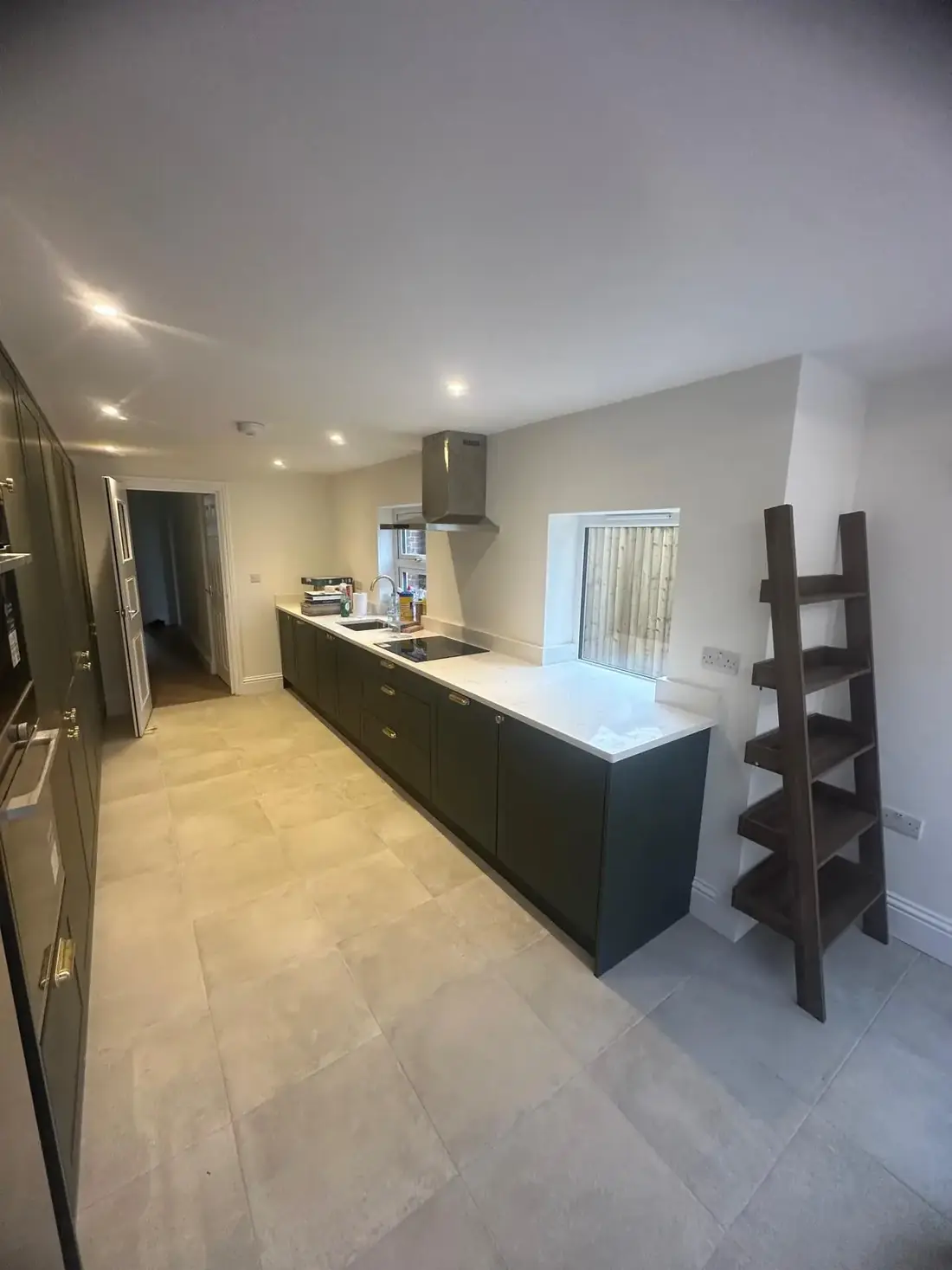 Finished kitchen with island in an Oxford house following a side return extension