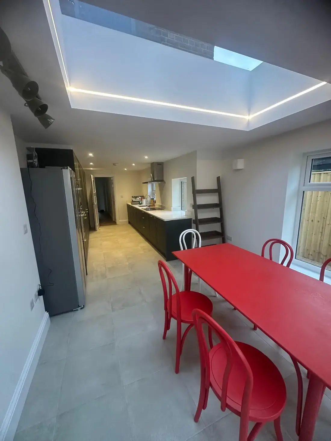 Kitchen and dining space in Oxford lit by a rooflight above a side return extension
